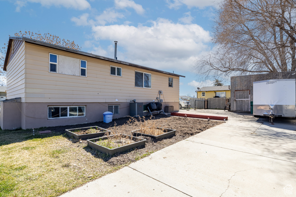Rear view of house with a vegetable garden