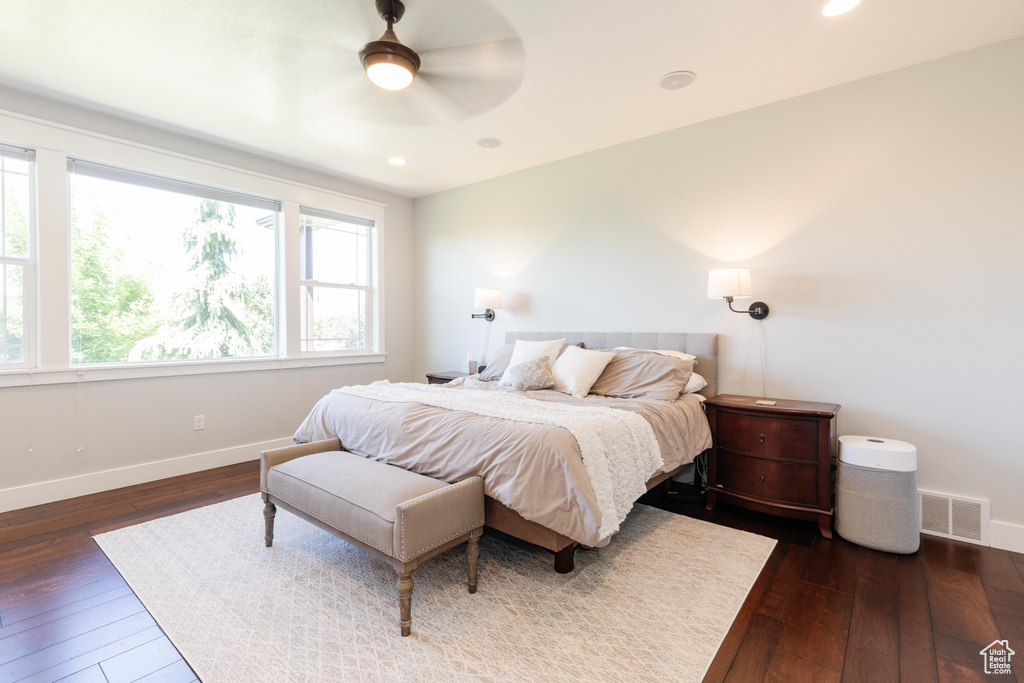 Bedroom with dark wood-style floors, recessed lighting, and a ceiling fan