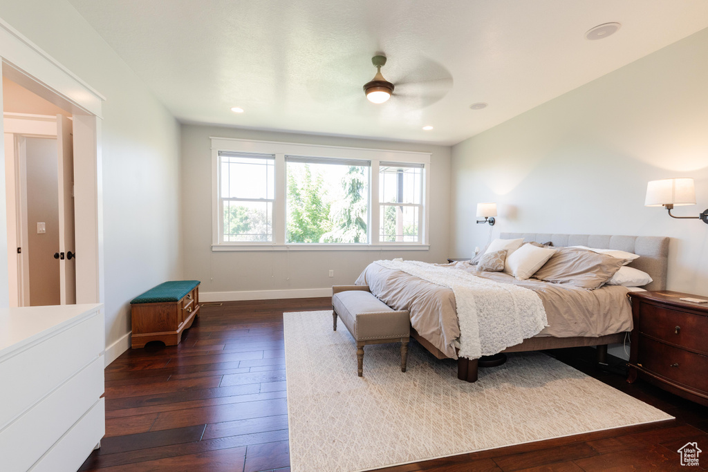 Bedroom featuring dark wood-style flooring, a ceiling fan, and recessed lighting