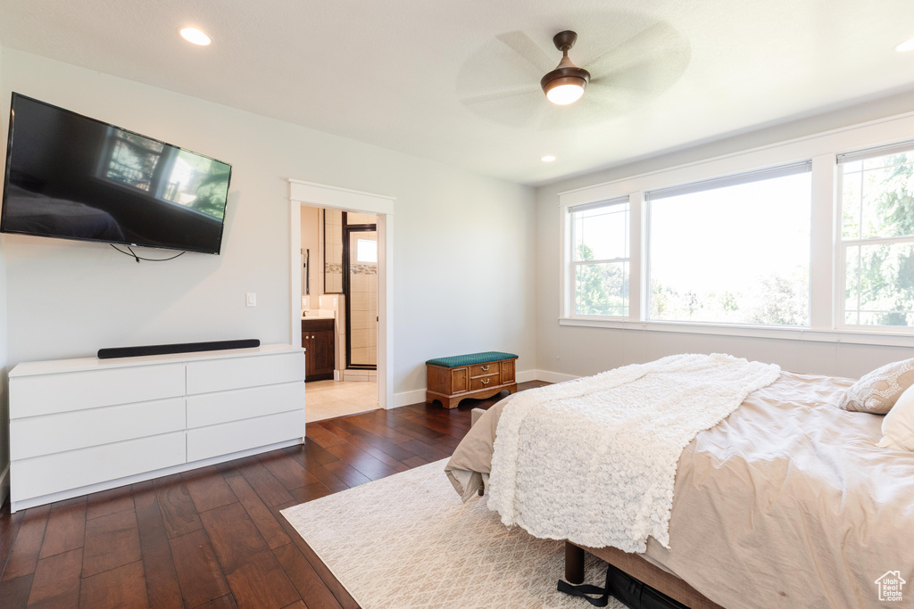 Bedroom featuring dark wood-style floors, recessed lighting, connected bathroom, and a ceiling fan