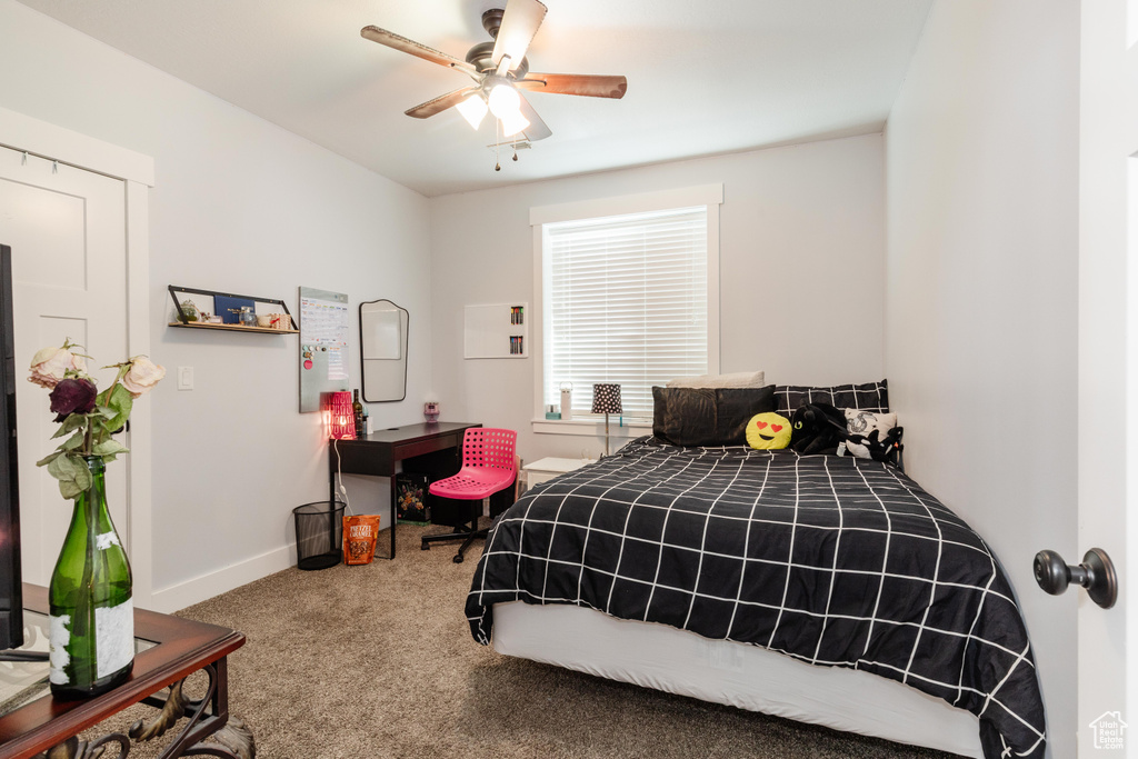 Bedroom featuring carpet flooring and ceiling fan