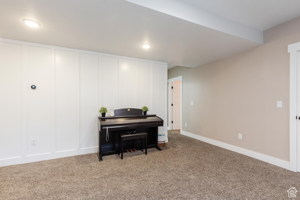 Sitting room with carpet and baseboards