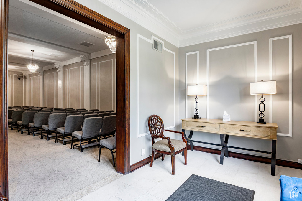 Home office with crown molding and baseboards