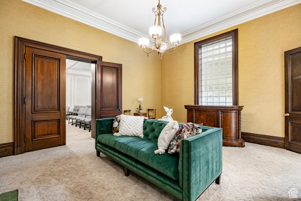 Living area featuring light carpet, a chandelier, and crown molding