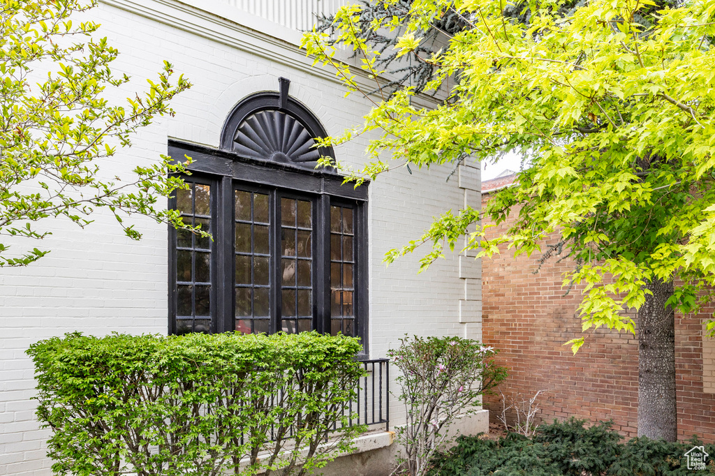 Entrance to property featuring brick siding
