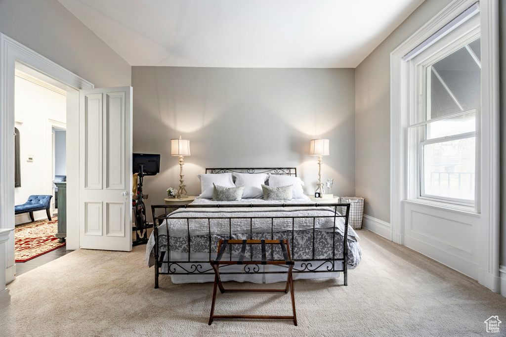 Bedroom with light colored carpet