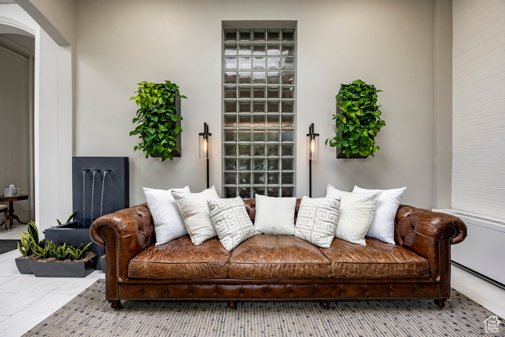 Tiled living room with arched walkways