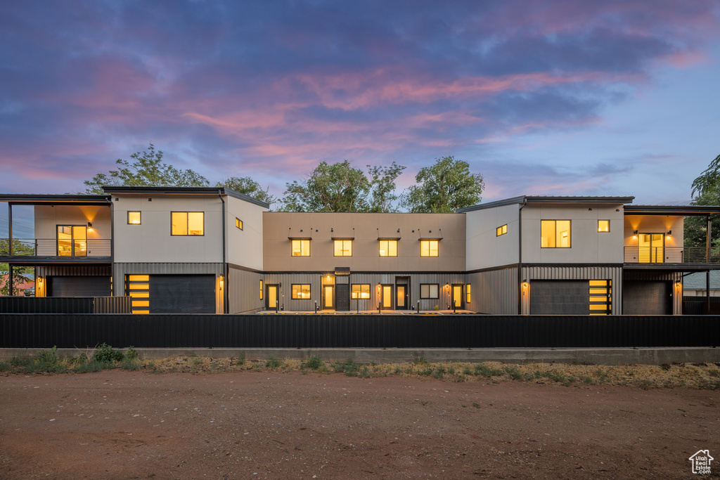 Back of property featuring a balcony