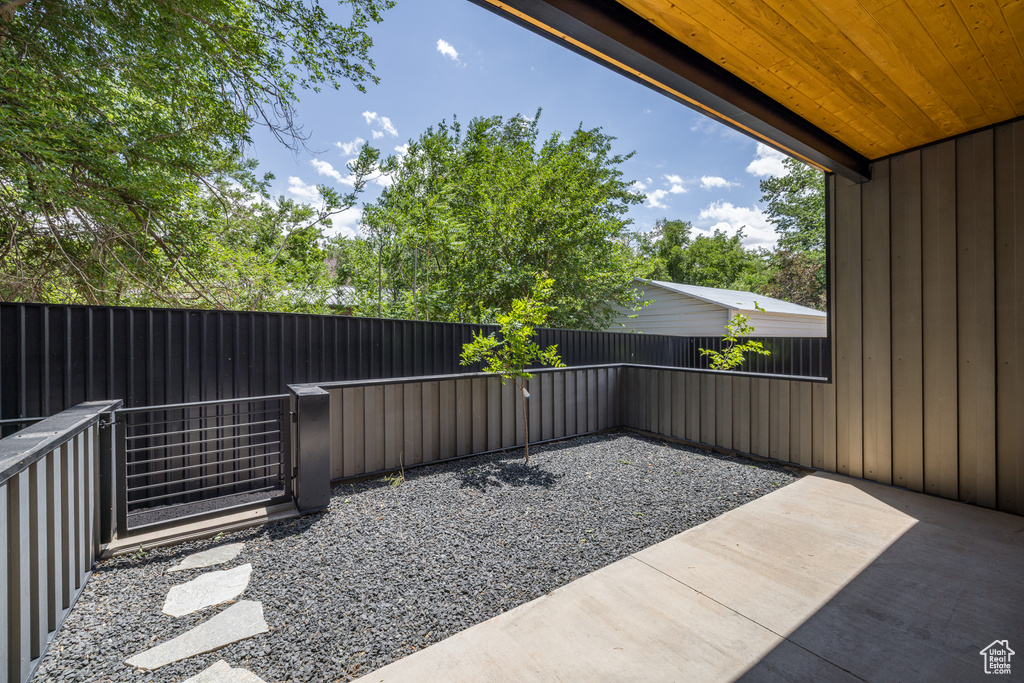 Fenced backyard featuring a patio