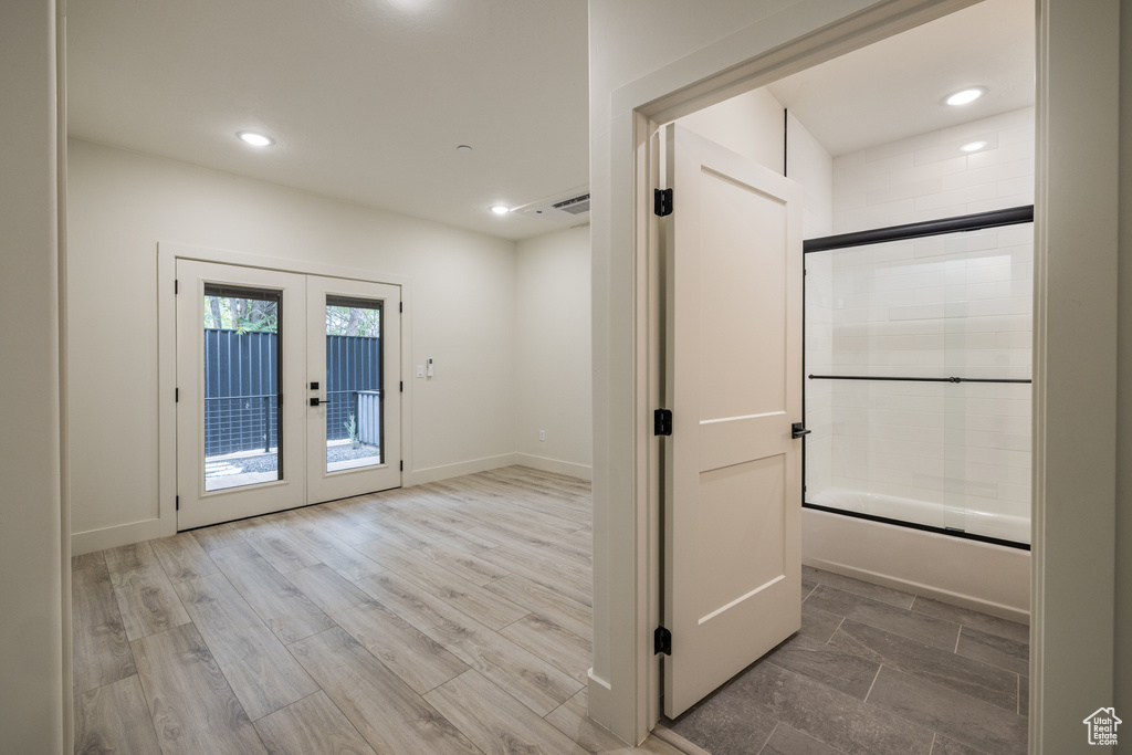 Doorway to outside featuring french doors, recessed lighting, and baseboards