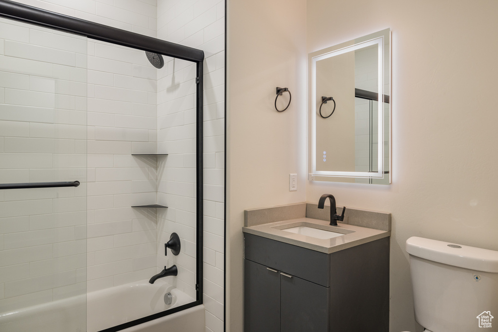Full bath featuring vanity, shower / washtub combination, and toilet