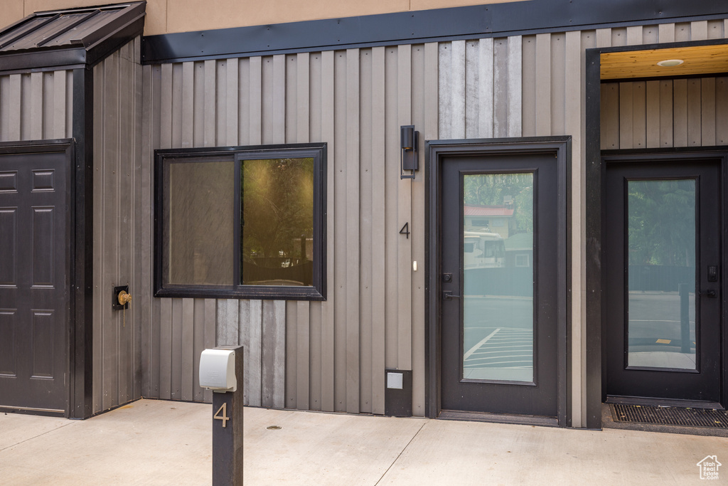 Doorway to property with board and batten siding