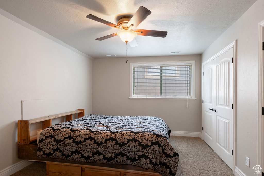 Bedroom with carpet floors and ceiling fan