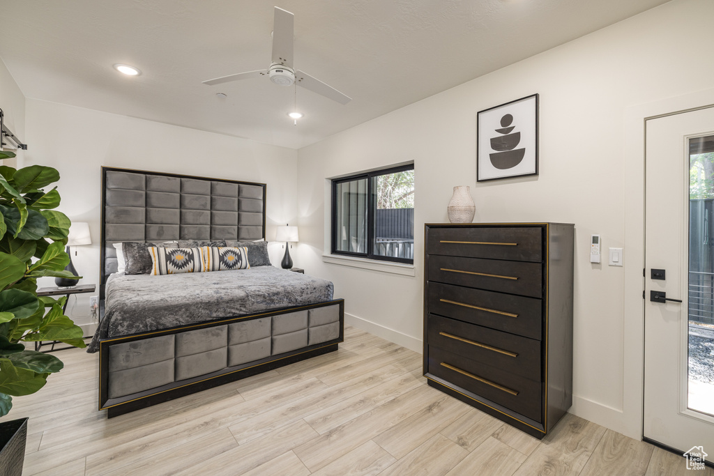 Bedroom with light wood-style floors, baseboards, recessed lighting, and a ceiling fan