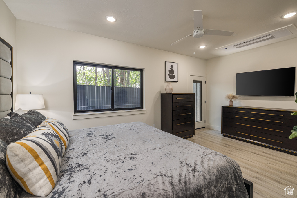 Bedroom featuring wood finished floors, recessed lighting, and a ceiling fan
