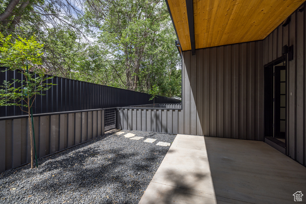 Fenced backyard with a patio