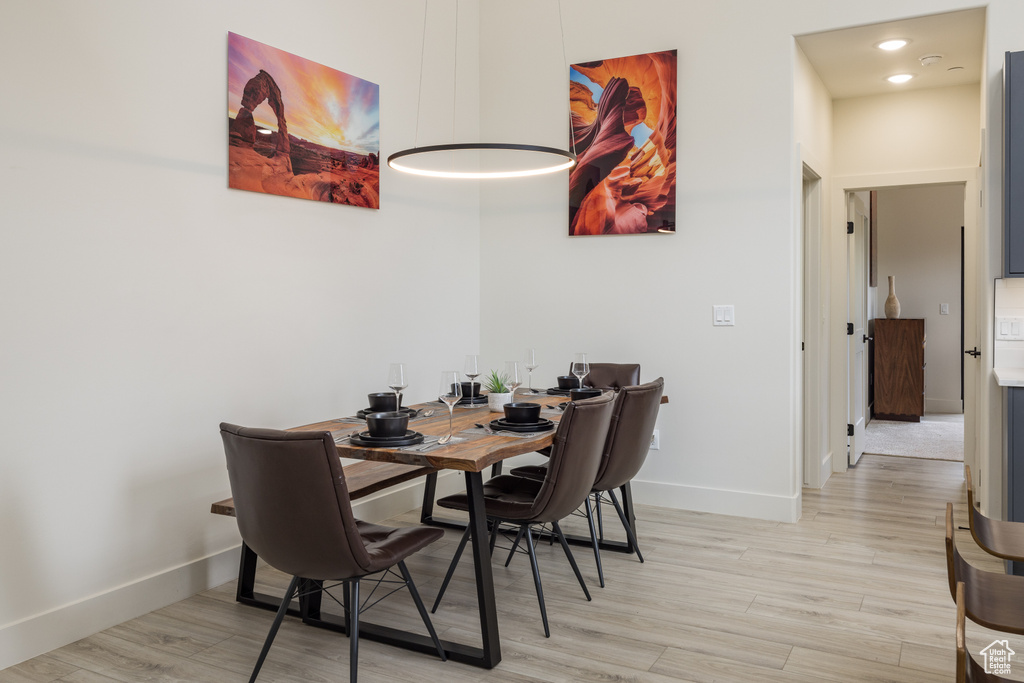 Dining room with baseboards and light wood-type flooring