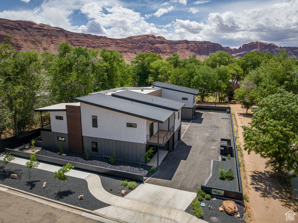 View of subject property with a mountain backdrop