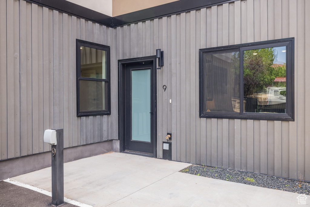 Property entrance with a patio