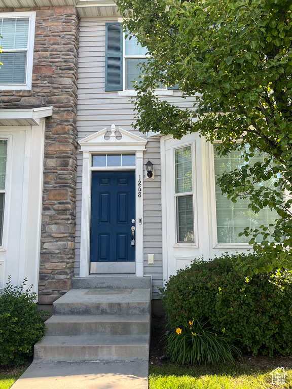 Property entrance with board and batten siding