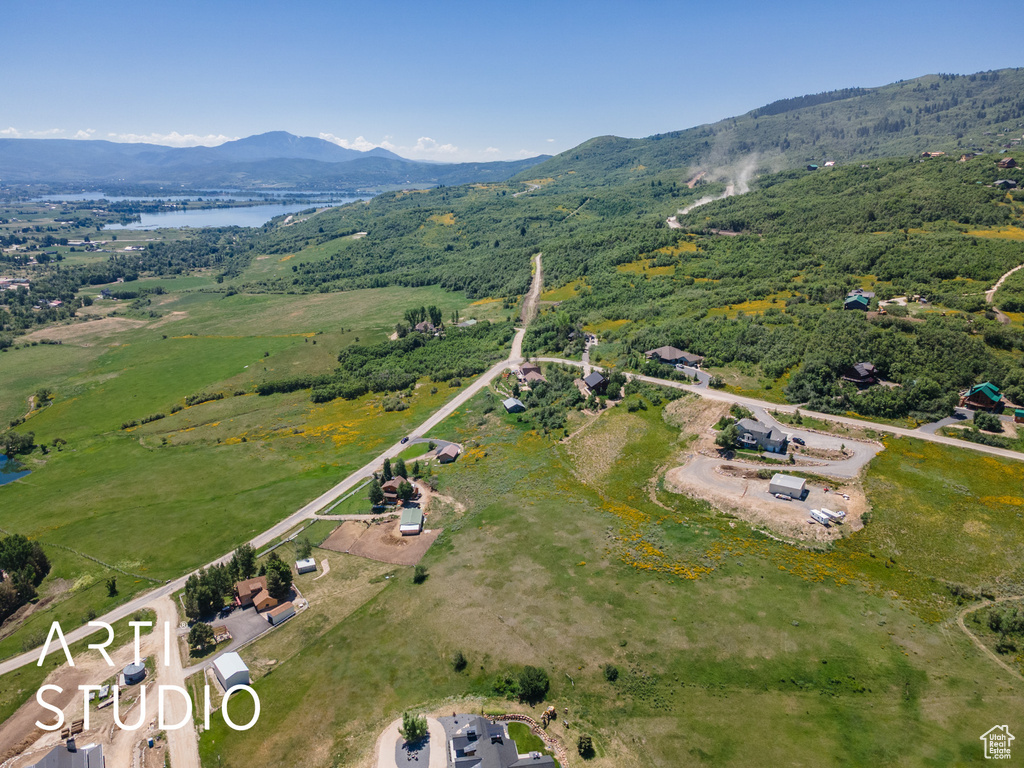 View of property location featuring a water and mountain view