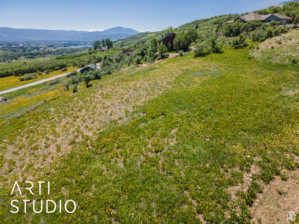 View of mountain background featuring rural landscape