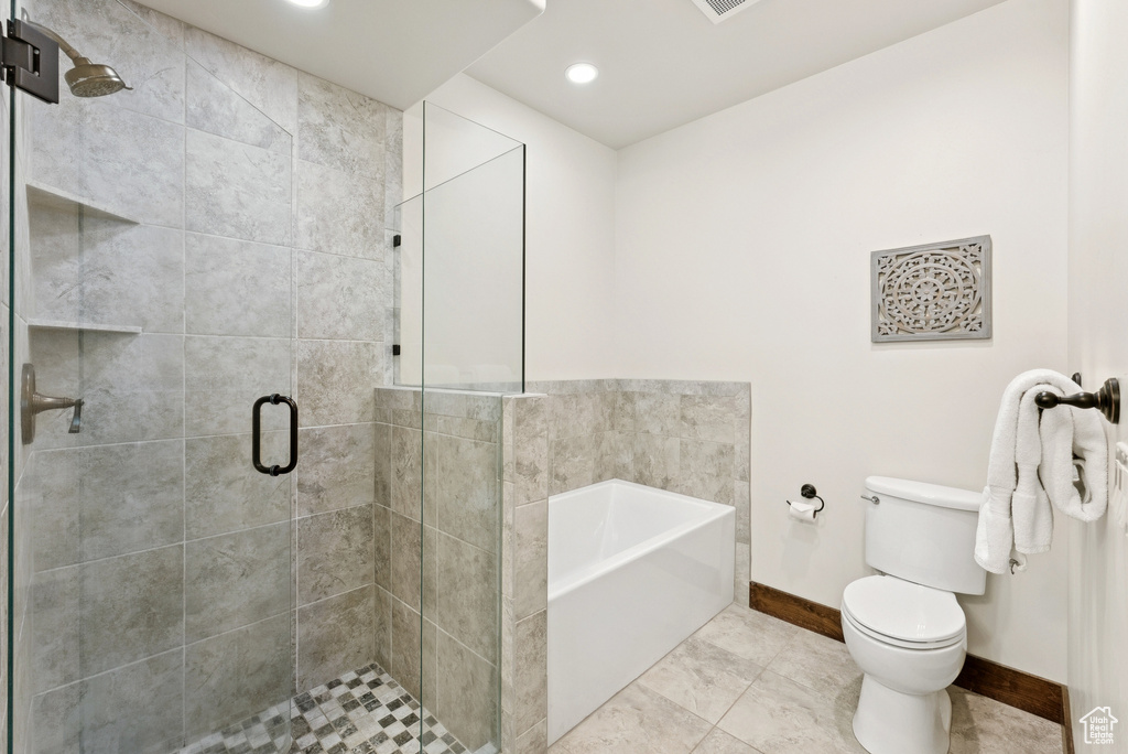 Full bath featuring a garden tub, a stall shower, and recessed lighting
