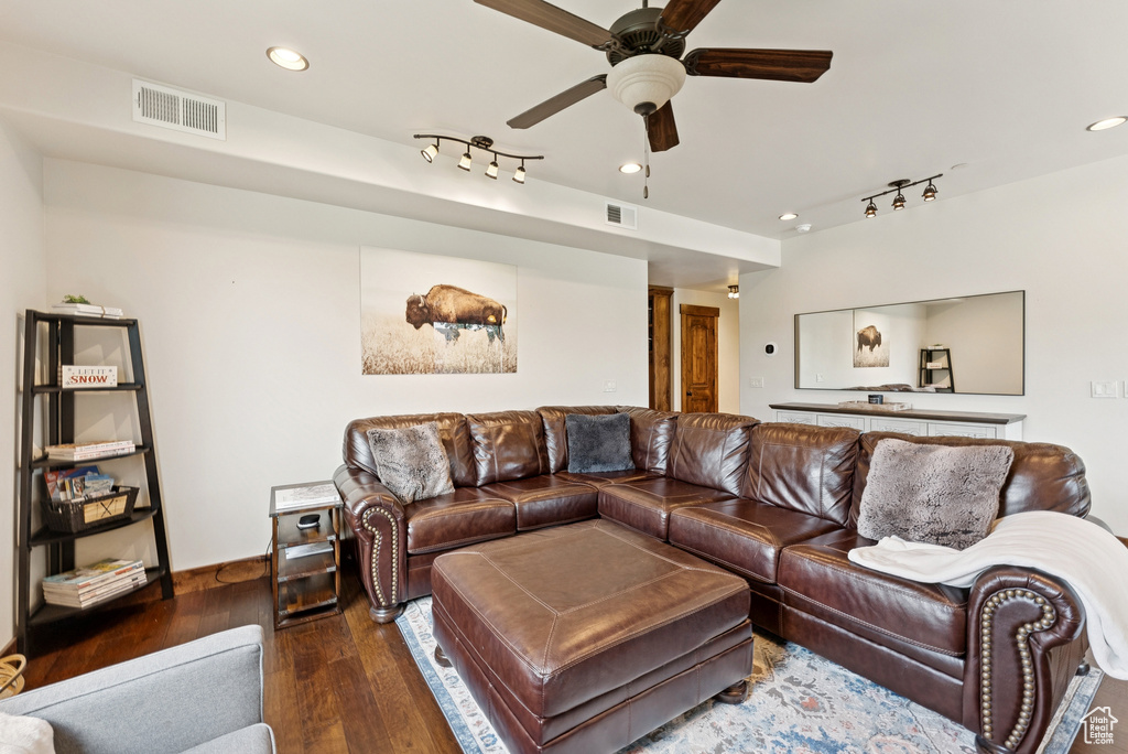 Living area featuring rail lighting, wood finished floors, a ceiling fan, and recessed lighting