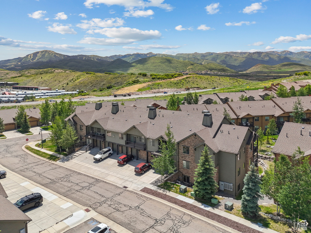 Aerial view of residential area featuring a mountainous background
