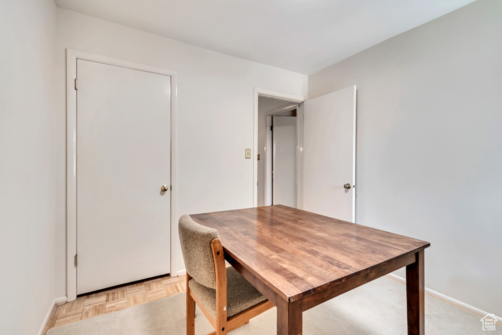 Dining area with baseboards and a desk