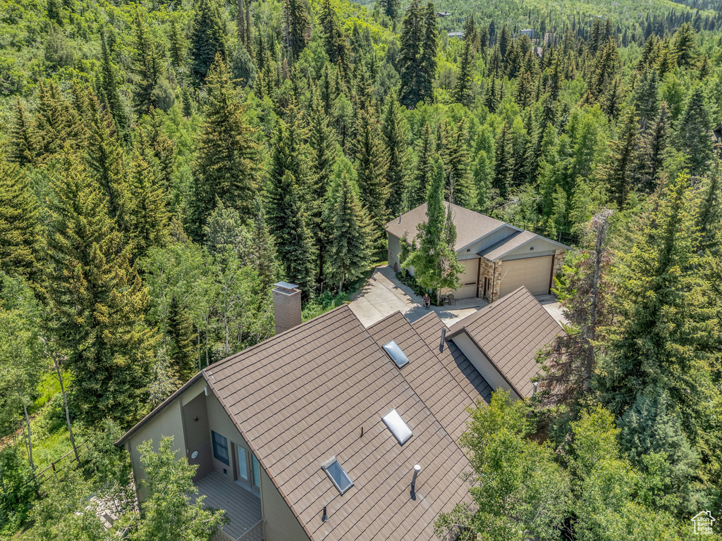 View of subject property featuring a forest