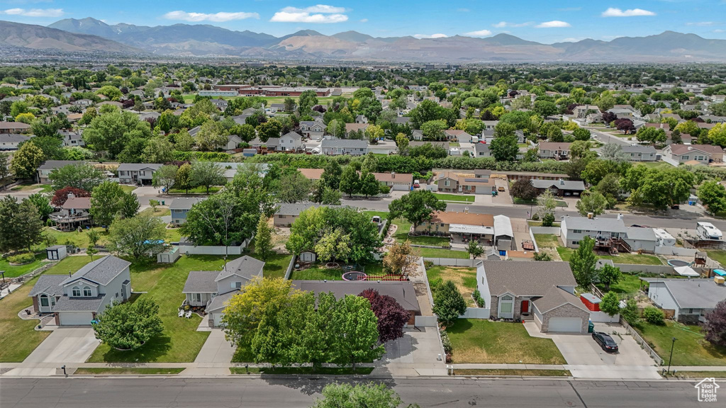 Aerial perspective of suburban area with a mountainous background