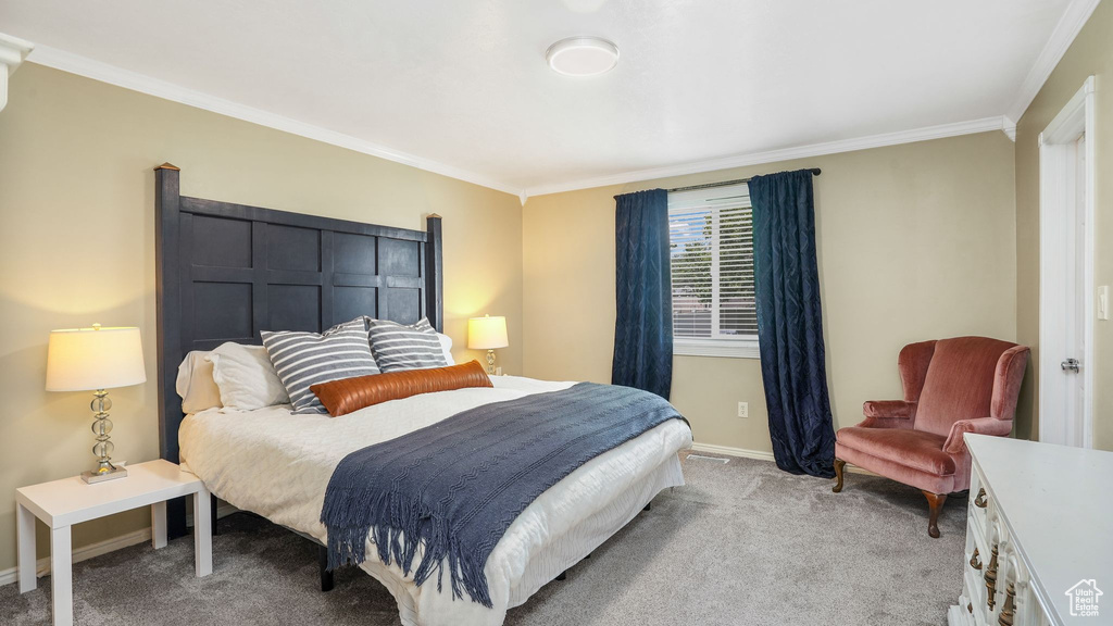 Bedroom featuring light carpet and ornamental molding