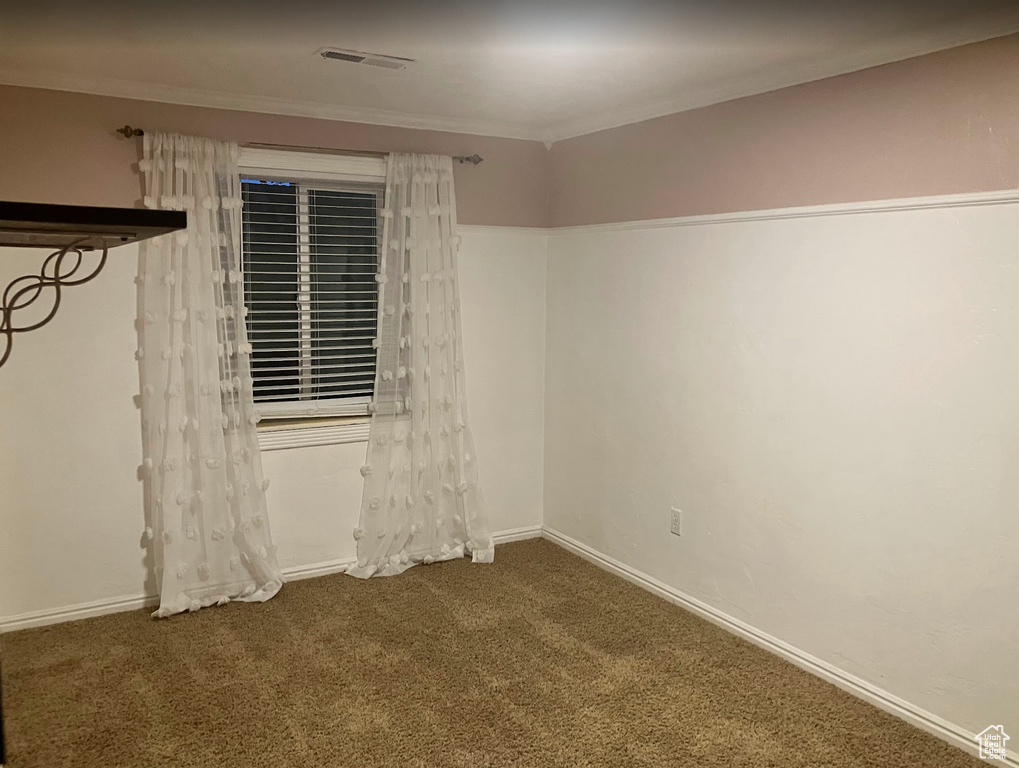 Unfurnished room with carpet flooring and ornamental molding