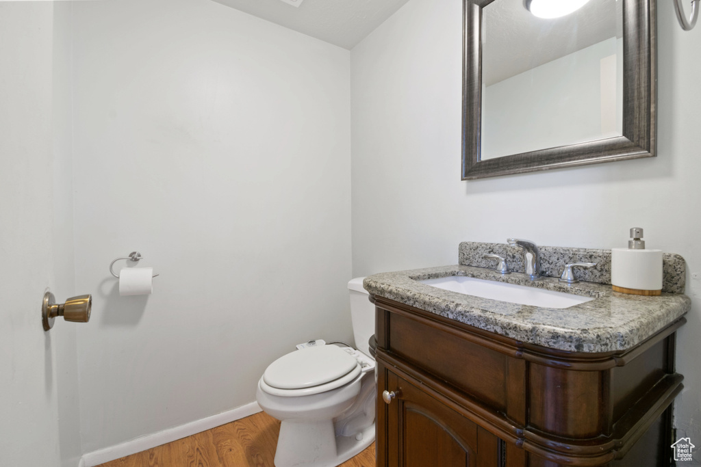 Bathroom featuring vanity and wood finished floors
