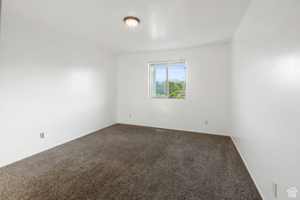 Empty room with carpet floors