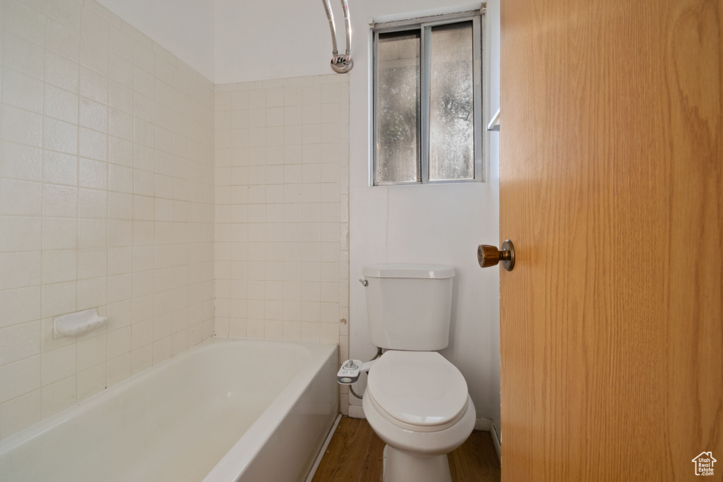 Bathroom featuring toilet and wood finished floors