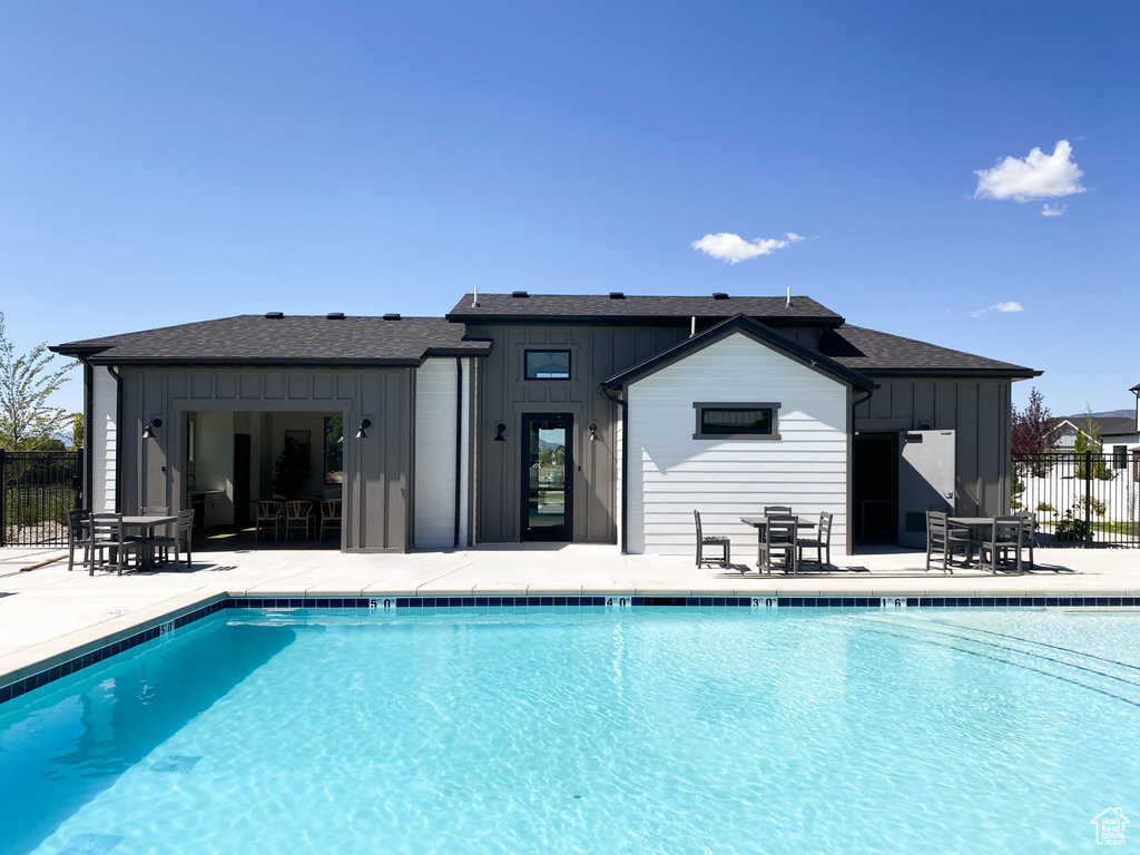 Community pool with a patio