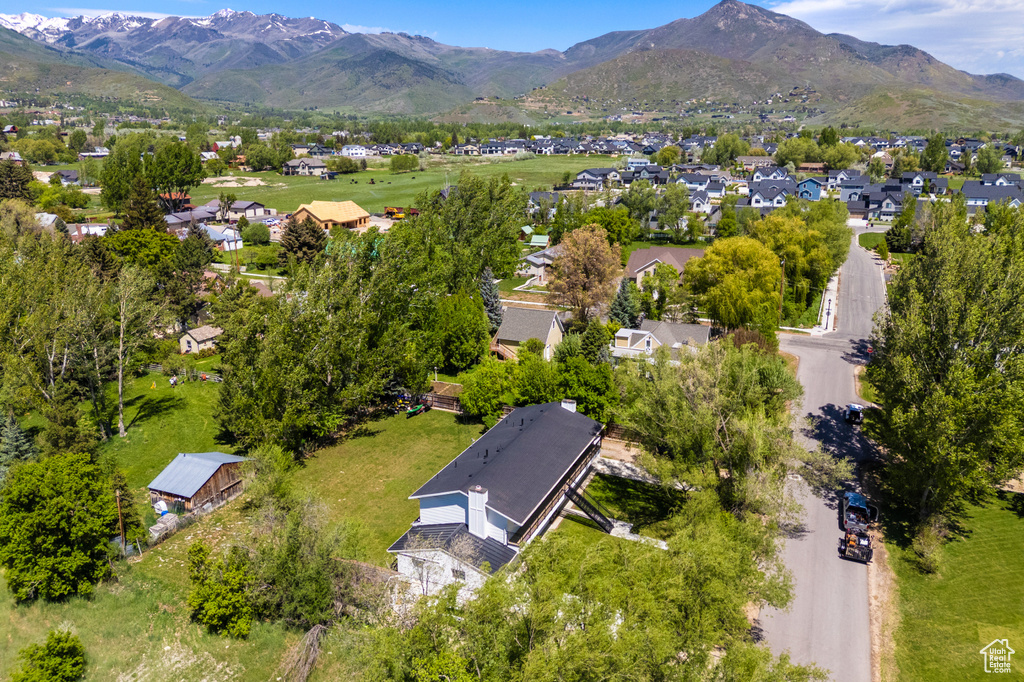 Aerial perspective of suburban area featuring a mountain backdrop