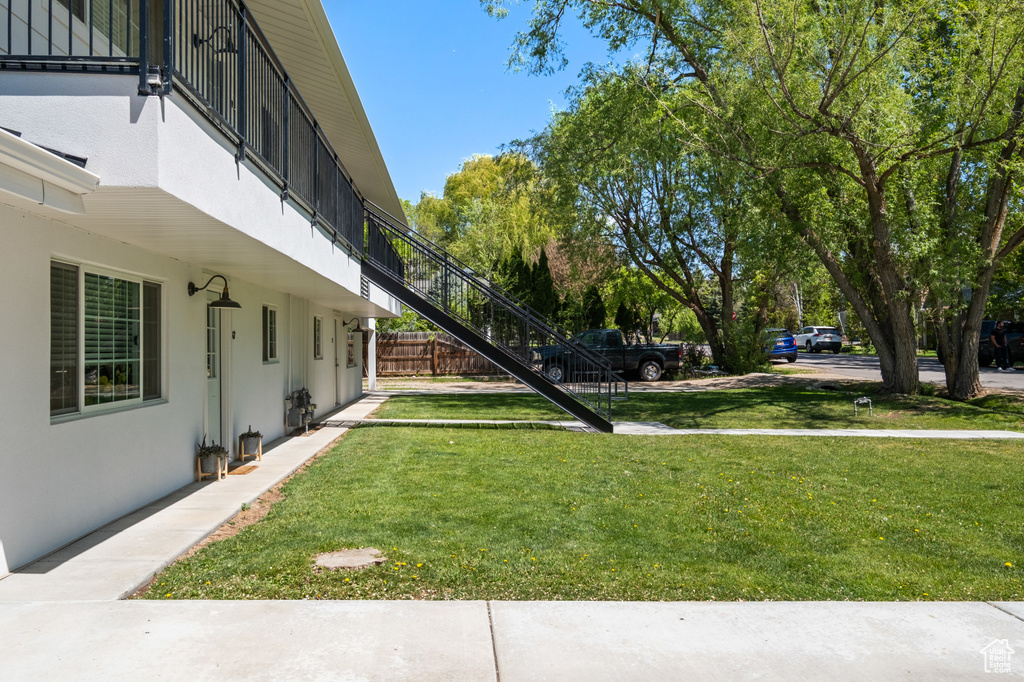View of yard featuring stairway