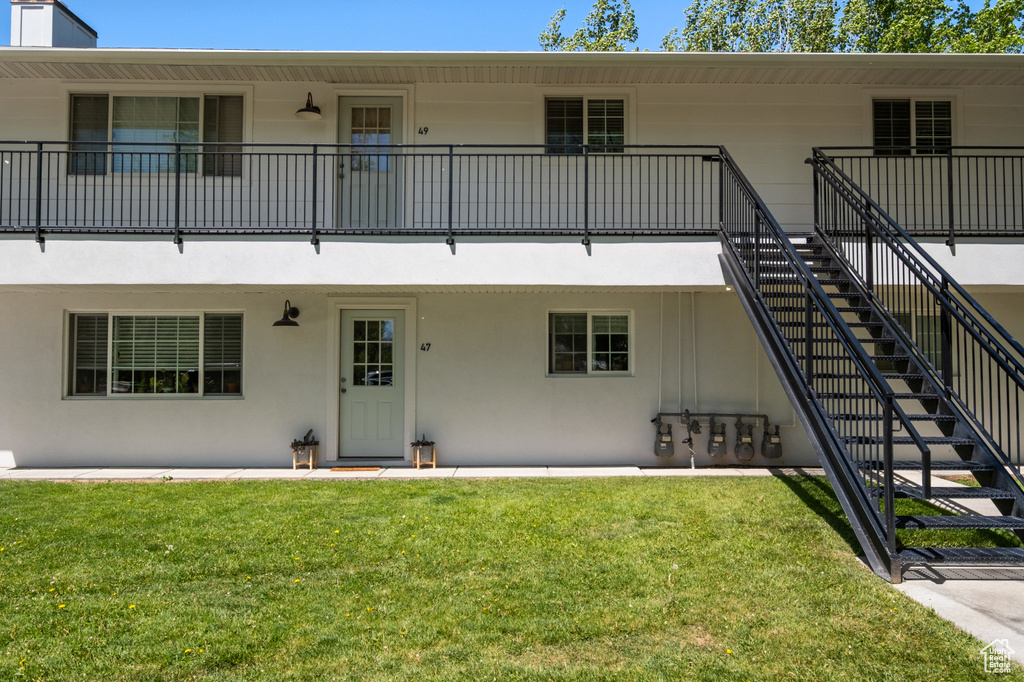 View of property with stairs