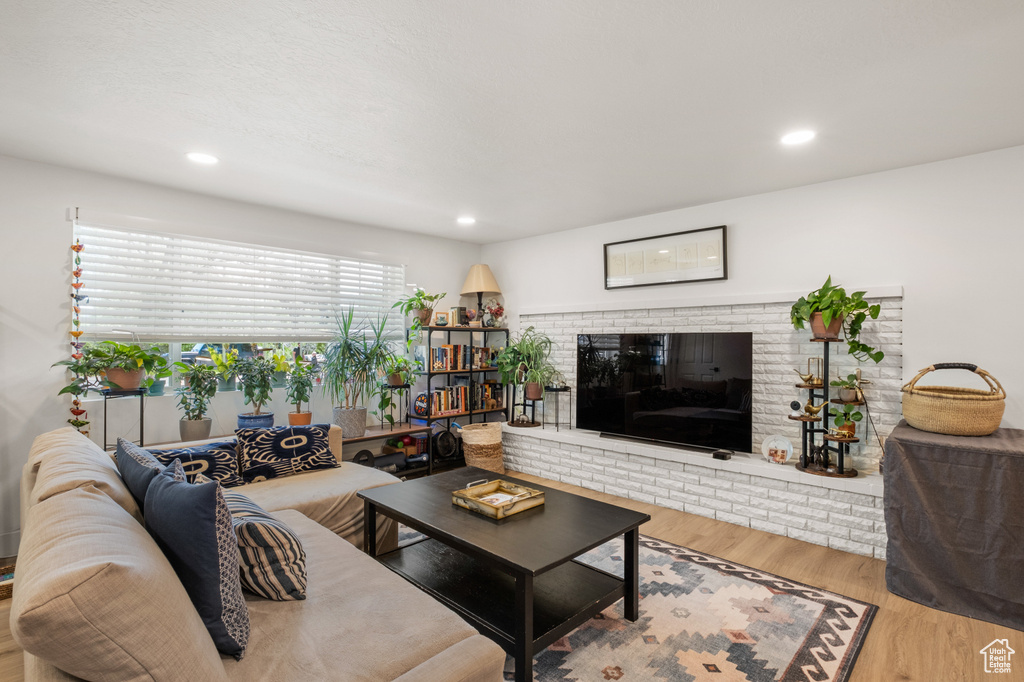 Living room featuring wood finished floors and recessed lighting
