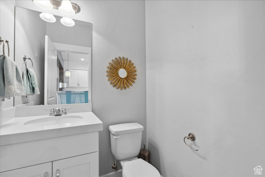Bathroom with toilet and vanity