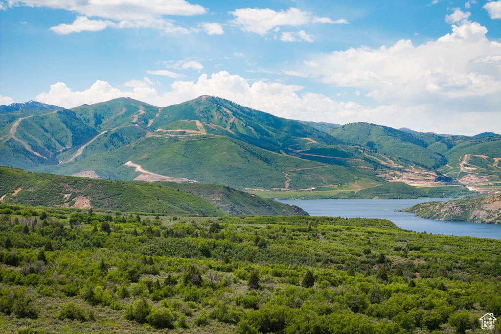 View of mountain backdrop featuring a large body of water