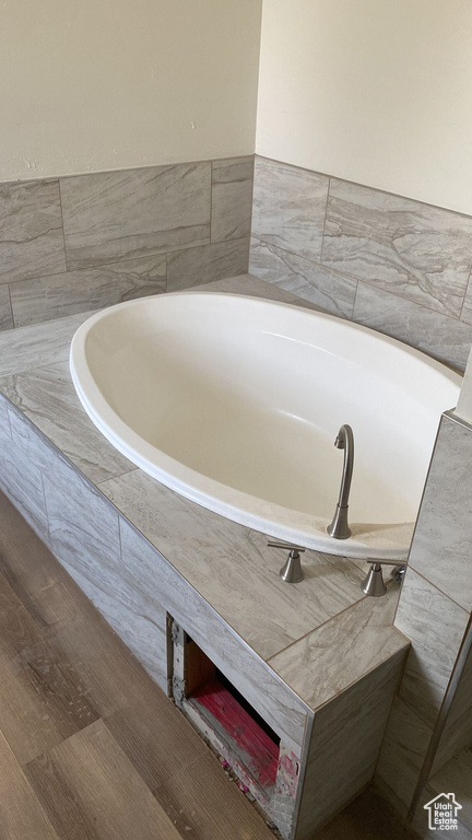 Full bath featuring a garden tub
