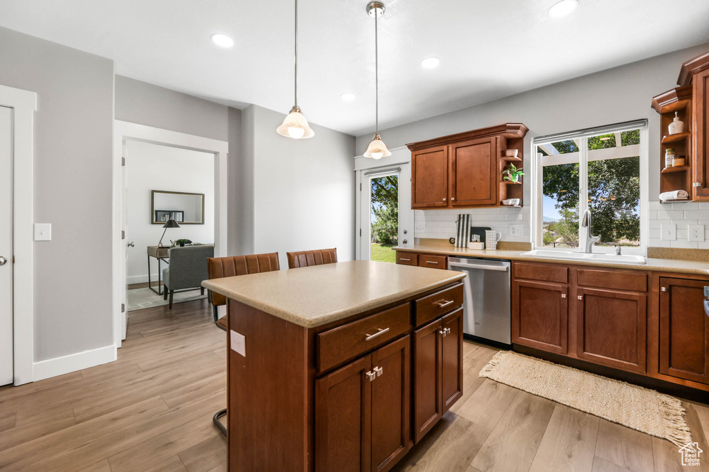 Kitchen featuring open shelves, dishwasher, tasteful backsplash, light wood-style floors, and recessed lighting