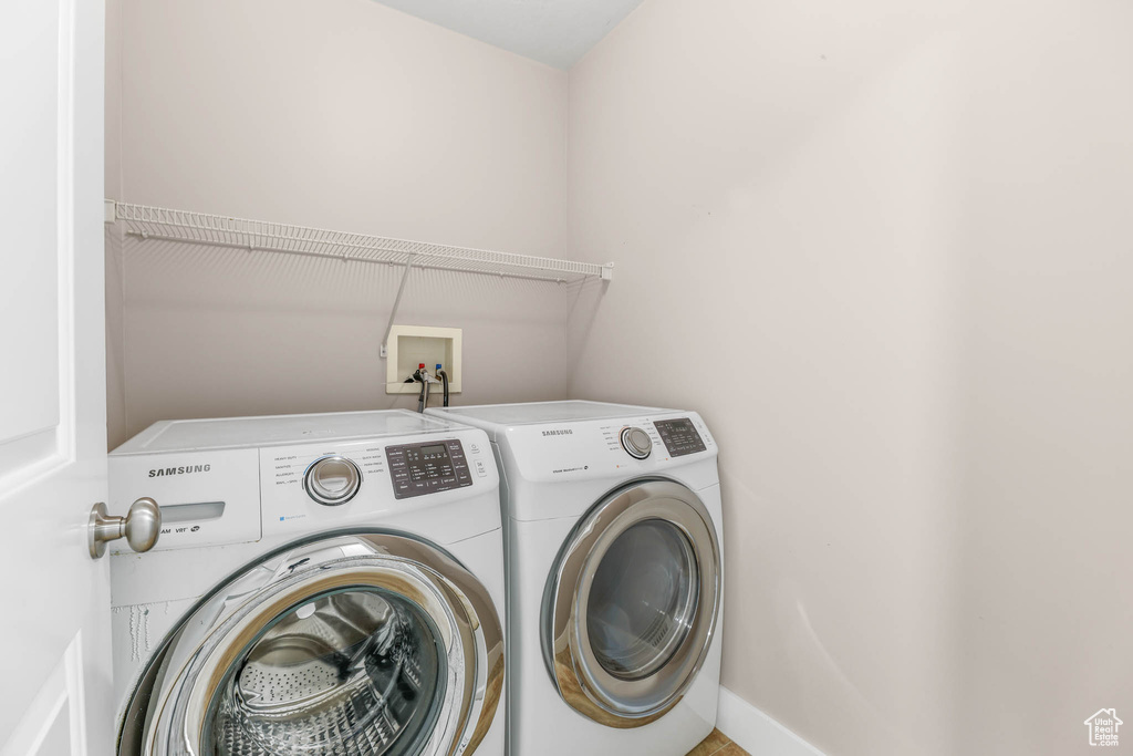 Laundry room featuring separate washer and dryer