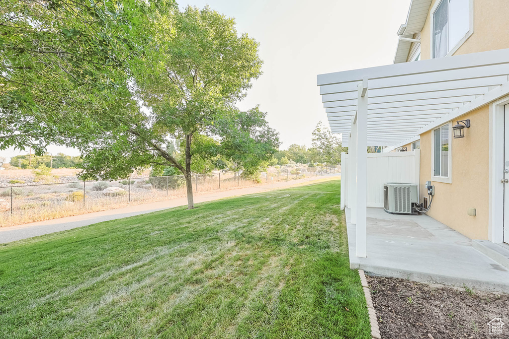 View of yard featuring a pergola and a patio area