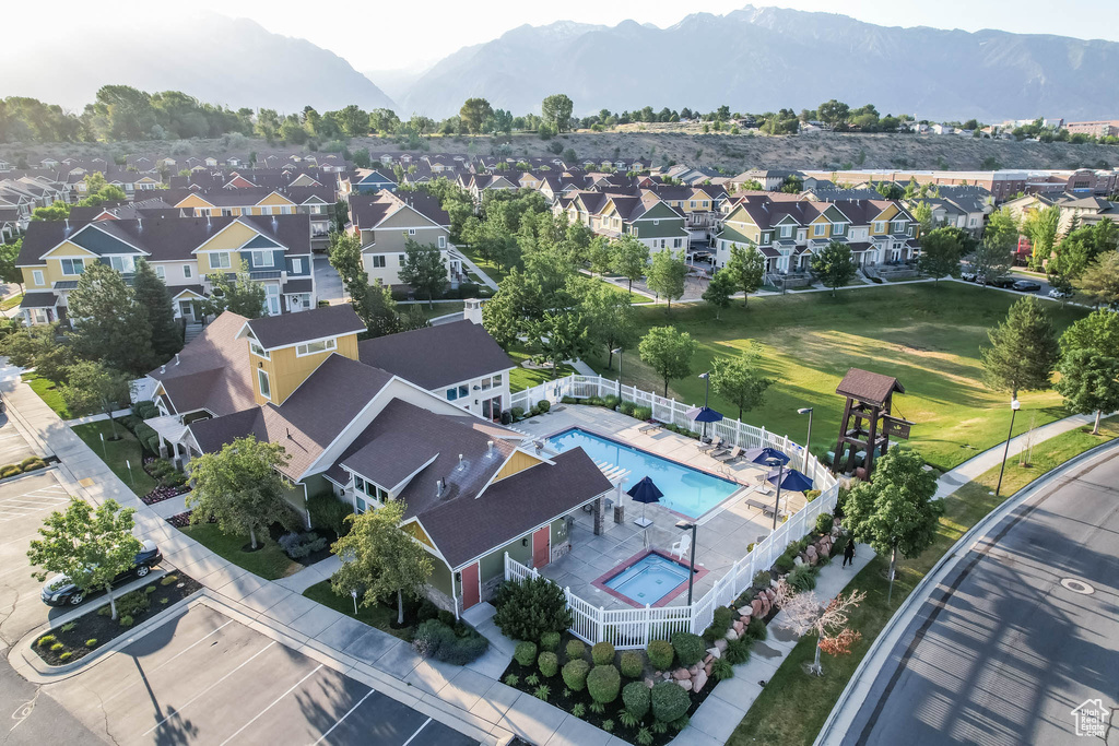 Aerial view of residential area featuring a mountain backdrop