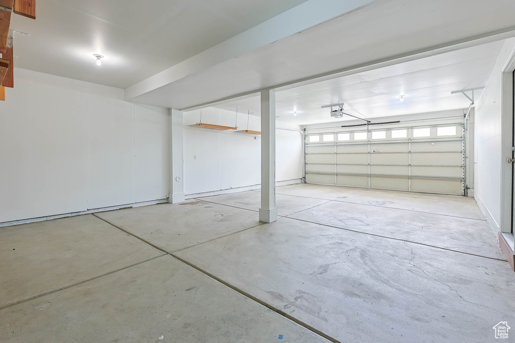 Garage featuring a garage door opener